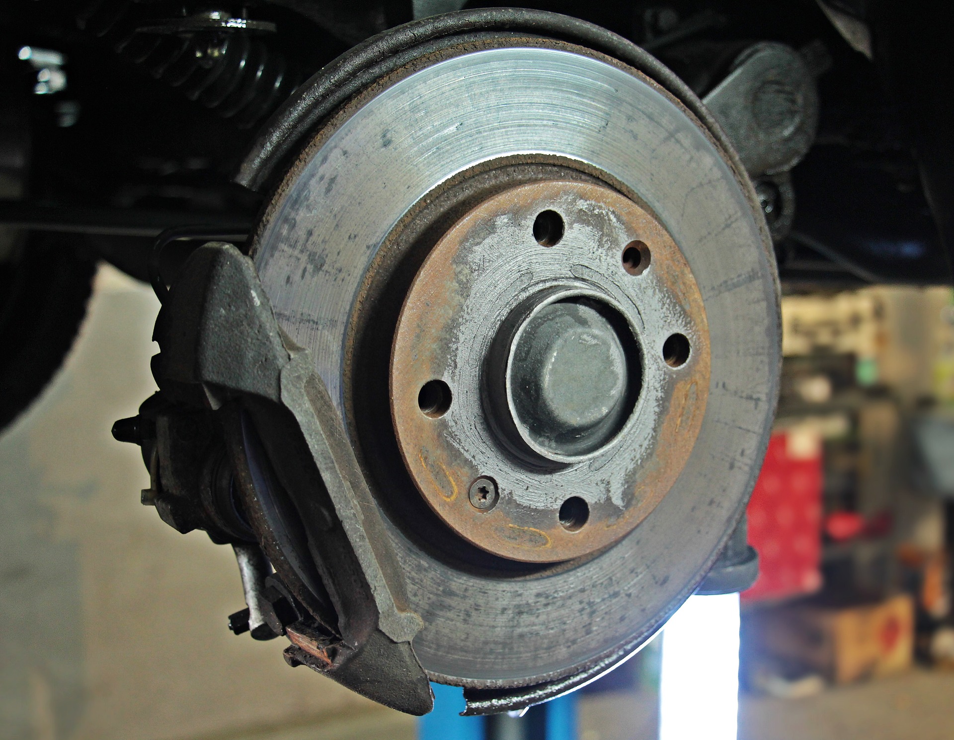 A car's wheel being repaired in an auto shop