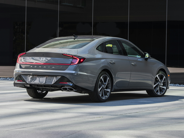A gray Hyundai Sonata driving on the road