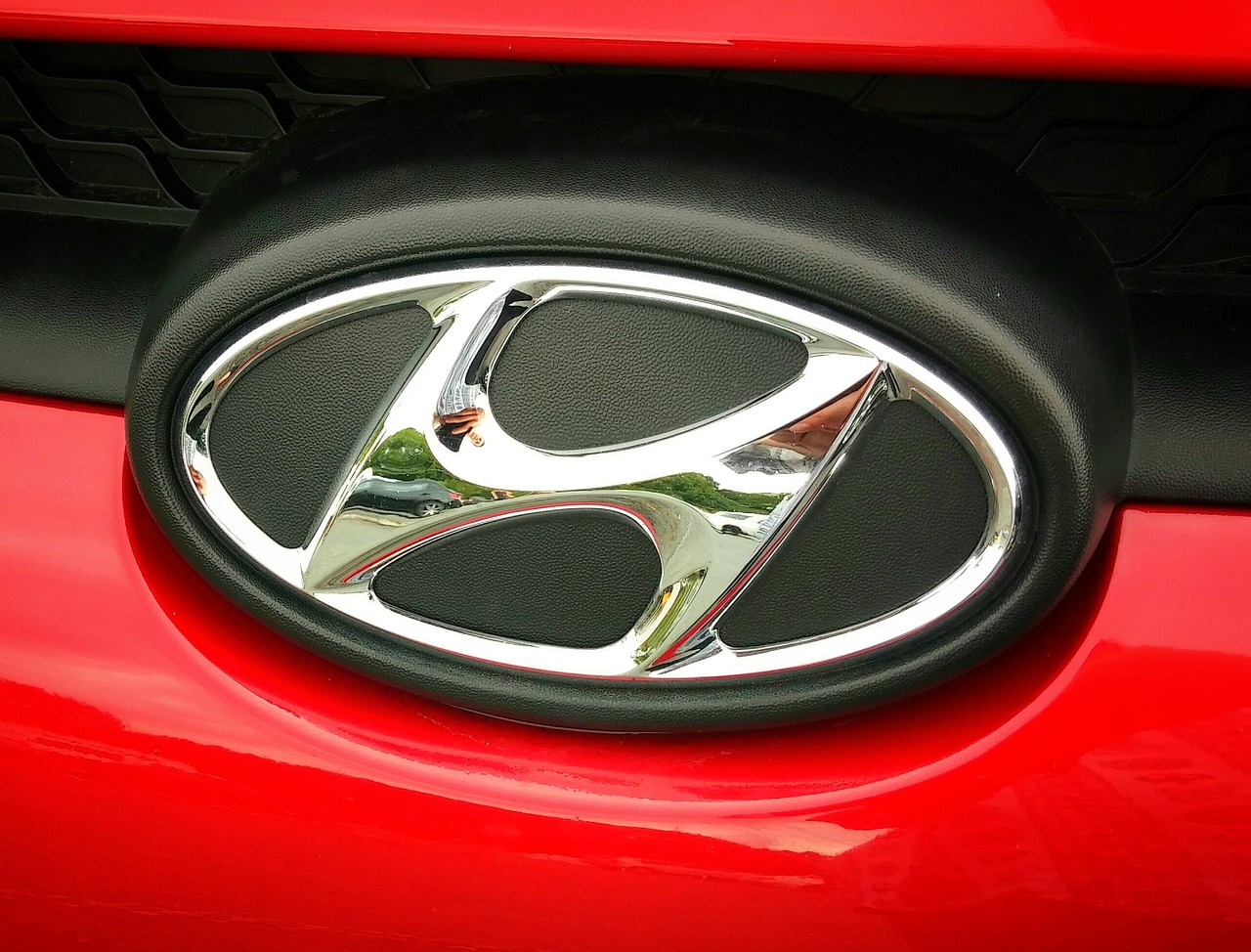 A Hyundai logo on a red vehicle