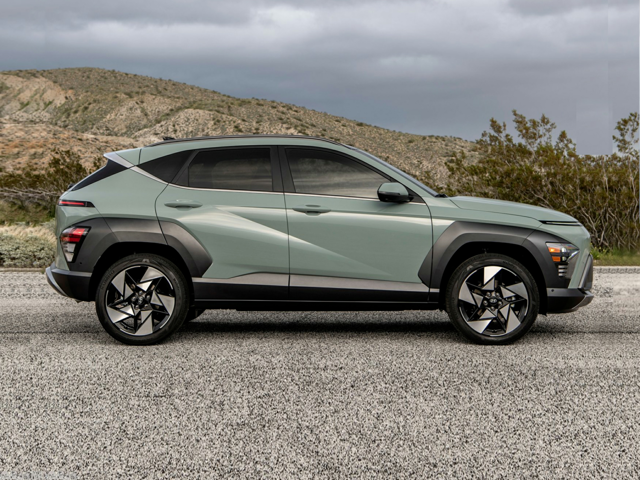 A green Hyundai Kona parked outside