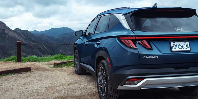 Blue Hyundai Tucson mountain overlook scene